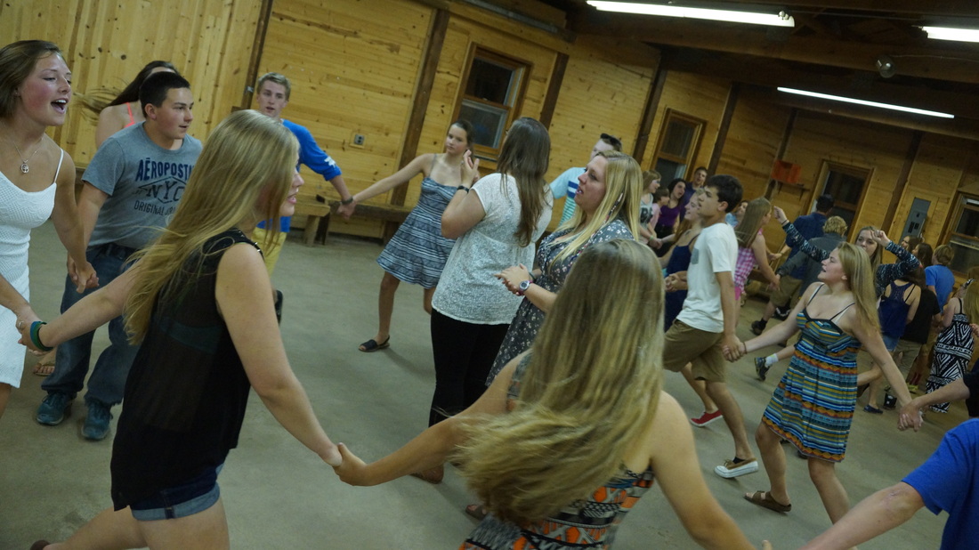 Campers learn to dance the waltz and popular American square dances
